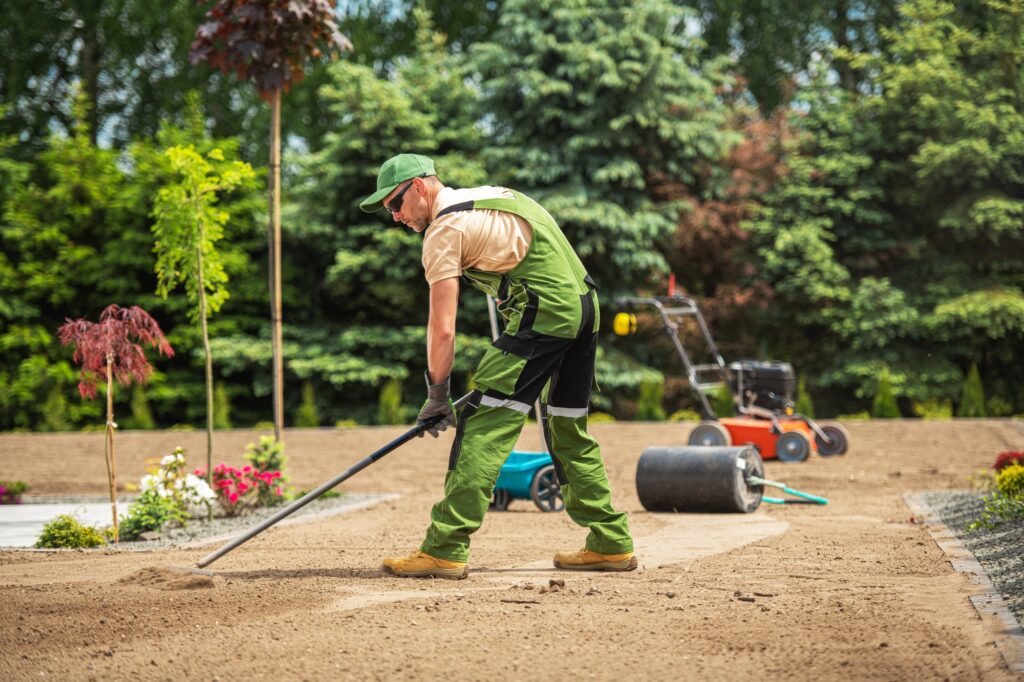 Professional Landscaper Replacing Residential Lawn